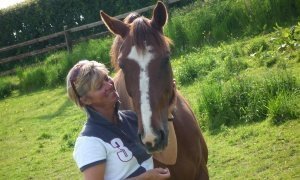 portrait of rosie withey who is an equine facilitated learning facilitator and wellness coach with her horse jack
