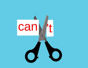 Illustration of a pair of scissors cutting the T off the word 'Can't' to make the word 'can'