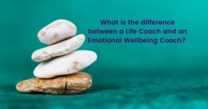 Four smooth pebbles on top of each other other against a serene turquoise background. The text on the image says what is the difference between a life coach and an emotional wellbeing coach.