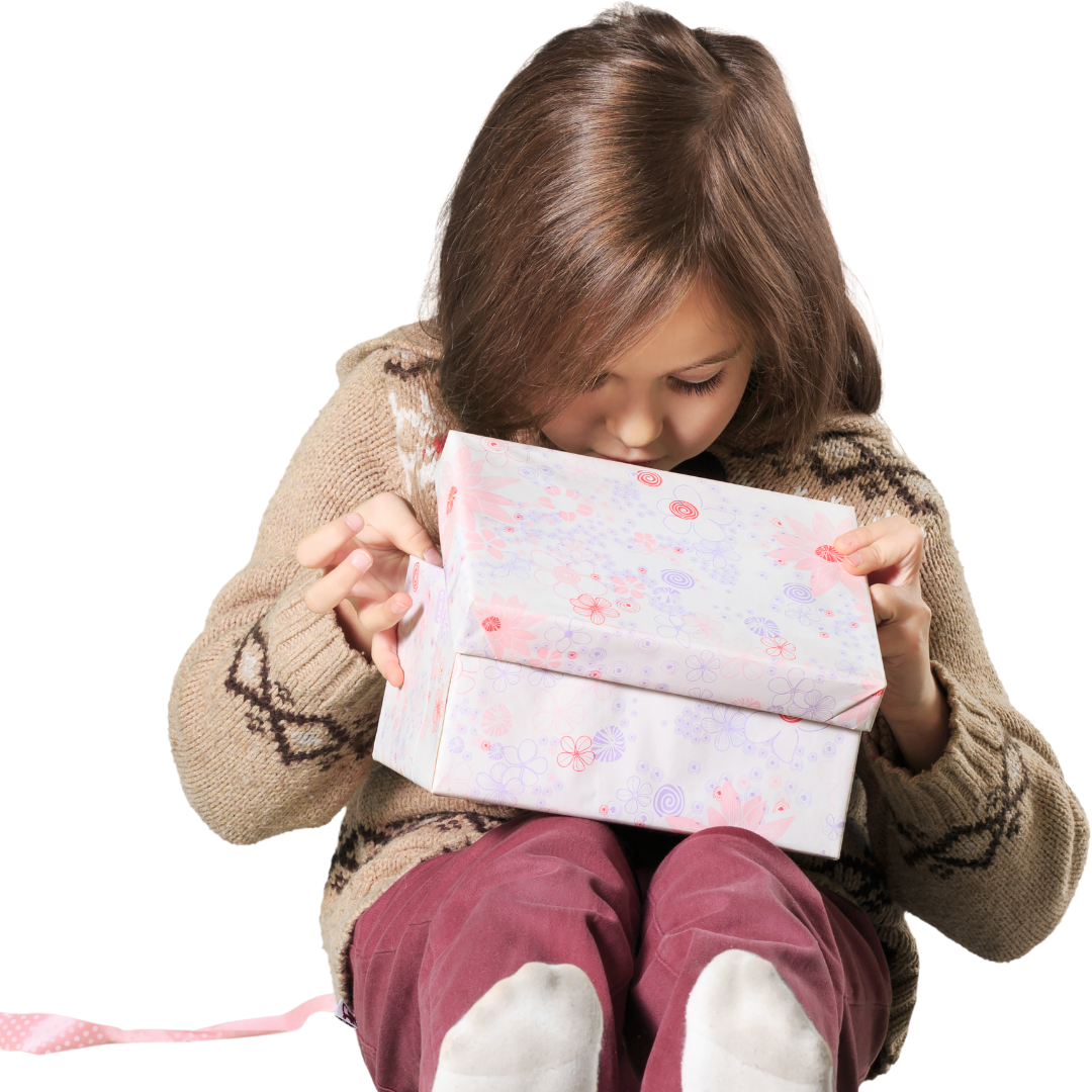 Young child looking into a gift box.