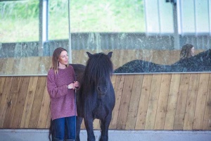 woman standing by a small horse in somerset uk
