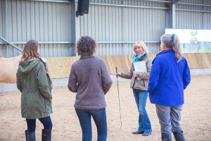 emotional wellbeing workshop instructor with a group