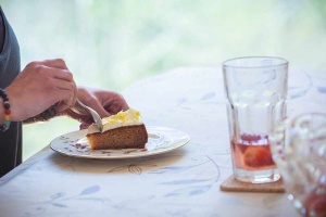 woman eating cake at the efl workshop at trealy farm