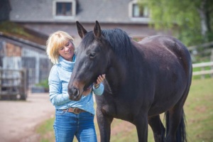 rosie withey with one of the horses from the eponaquest programme